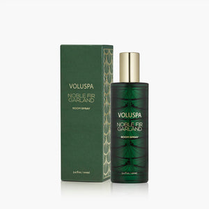 Voluspa Noble FIr Garland Room spray bottle next to packaging. 