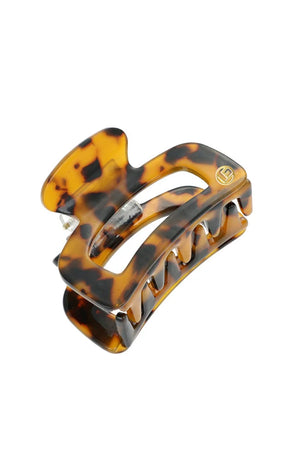 Tortoiseshell hair clip on a white background
