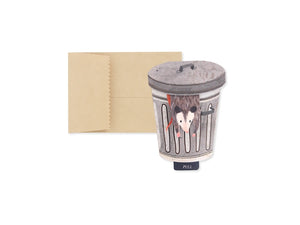 Pop up greeting card of a possum in a trash can on a white background with brown envelope included. 
