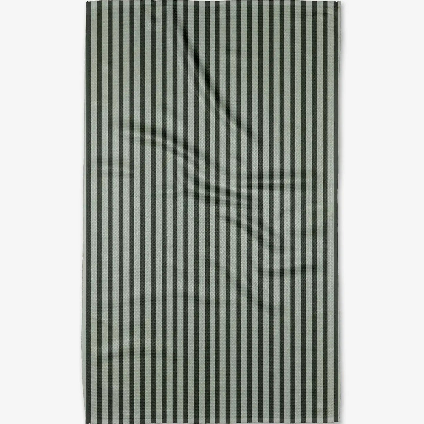 Vertical striped green on green tea towel against a white background. Geometry. 