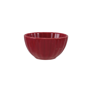 Red ribbed ceramic bowl on a white background. 