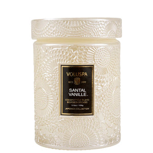 5.5 ounce cream colored glass jar candle in scent Santal Vanille from Voluspa. 