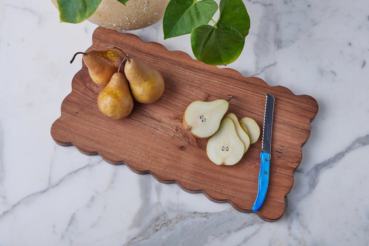 rectangular scalloped edge acacia wood cutting board with pears displayed. Handmade in India. Old world charm kitchen decor. 