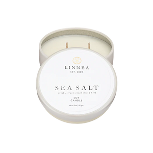 LINNEA Sea Salt candle in a white container on a white background
