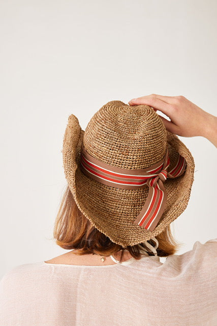 Raffia sun hat with red and brown fabric band. Mersea.