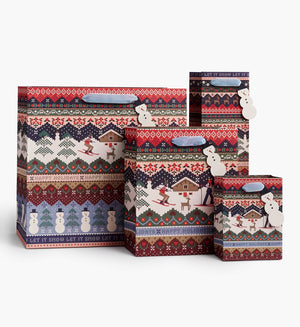 Set of four gift bags featuring a seater-inspired ski scene, with blue velvet handles and snowmen hang tags.