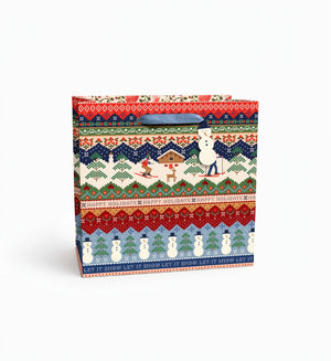 gift bags featuring a seater-inspired ski scene, with blue velvet handles and snowmen hang tags.