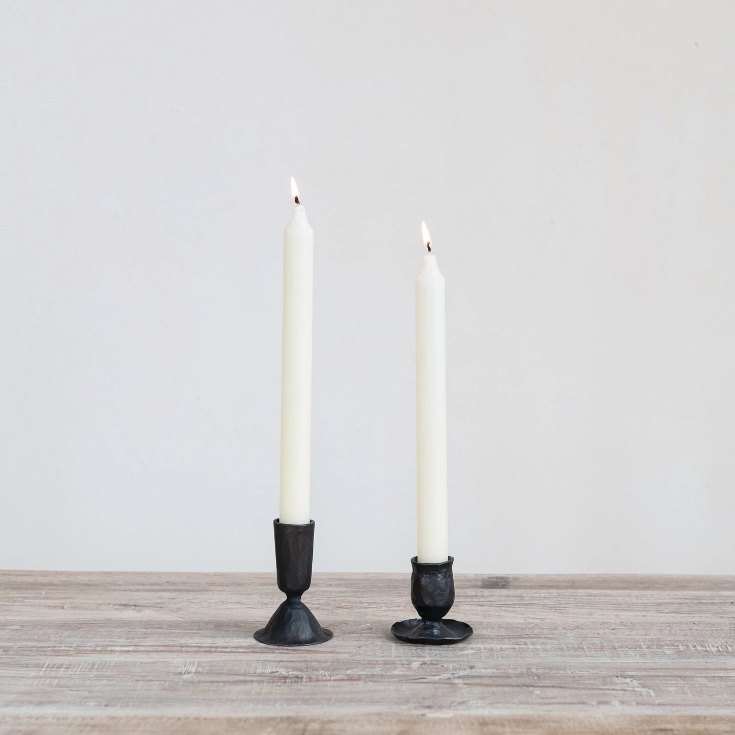 Small hand forged cast iron candle taper holder in black. Artisan style. 