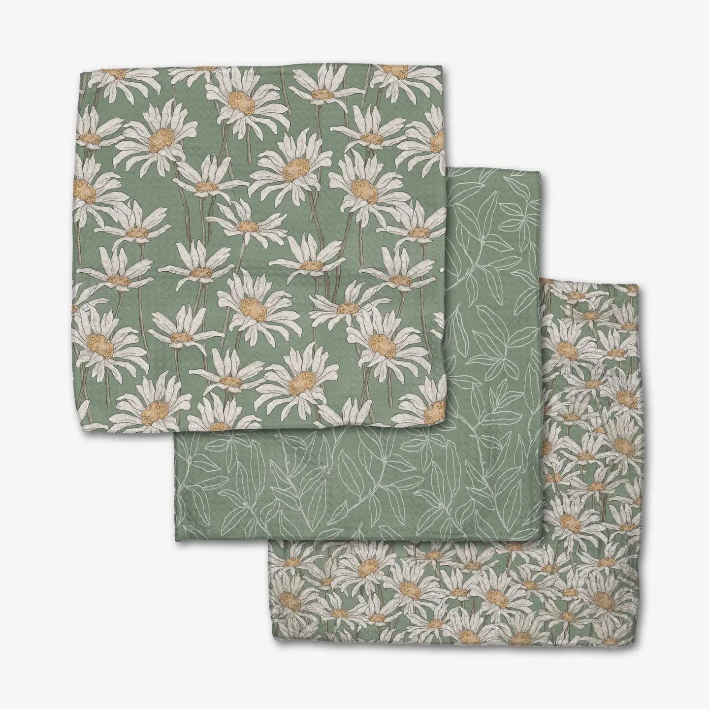 Set of three green dishcloths with green daisy and floral patterns on a white background
