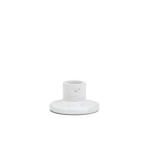 white taper candle holder with black speckles