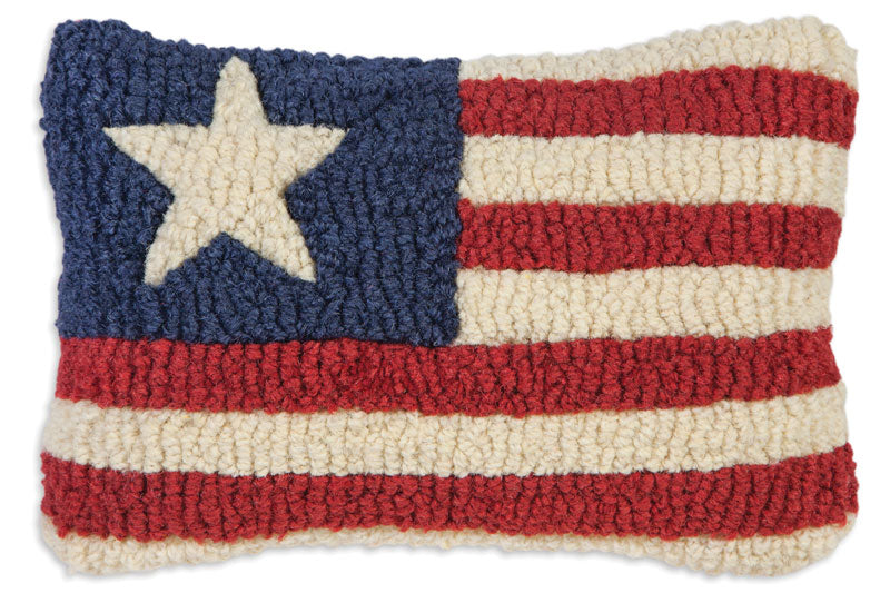 Handmade American flag pillow with red, white, and blue stars and stripes. Measures eight by twelve inches, wool material. 