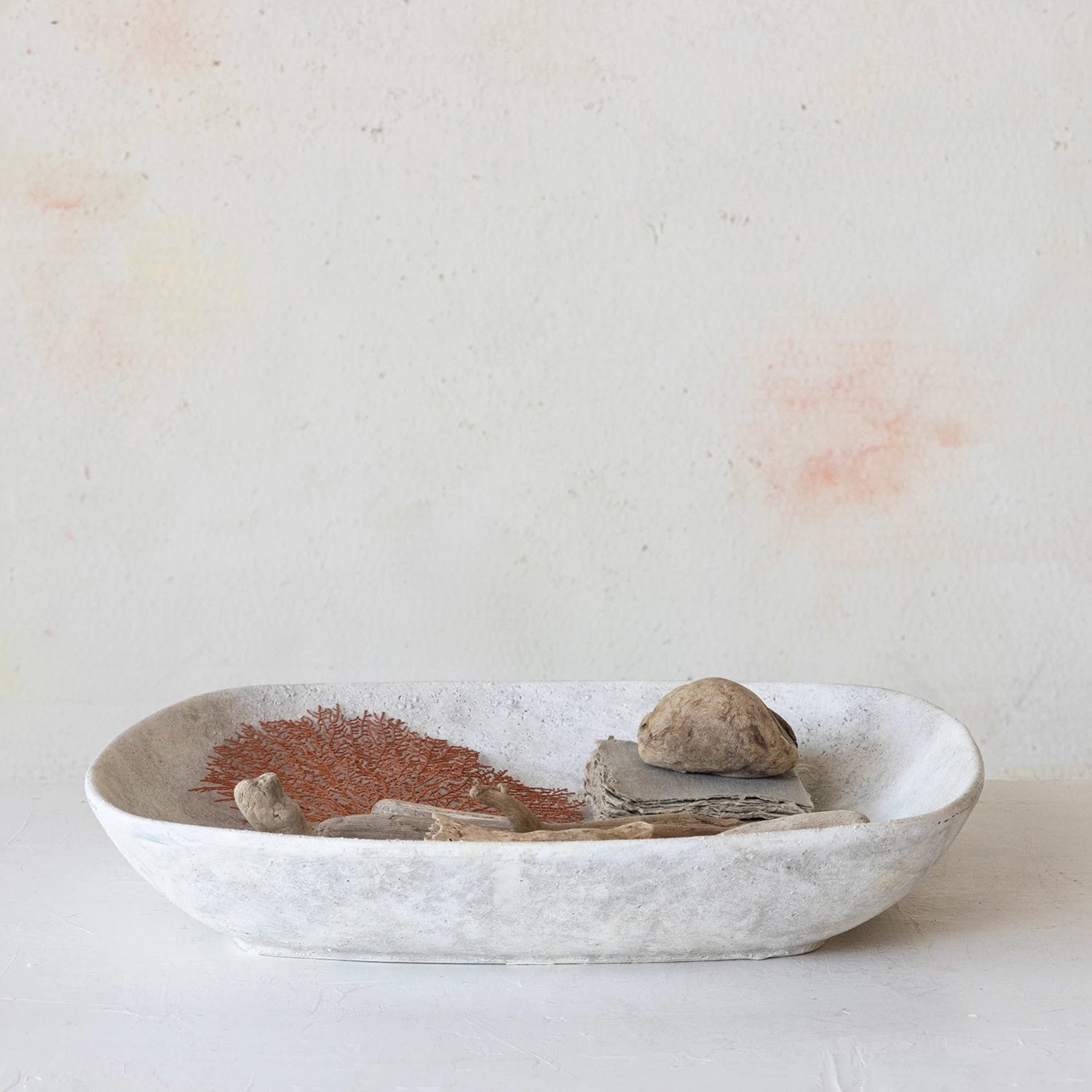 Stone tray with sticks and rocks for home decor