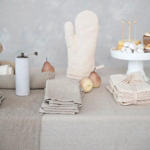 Gorgeous ivory stonewashed linen napkins on a neutral tablescape with artisan goods. Waffle knit. Linen. Neutral Modern kitchen accessories. 