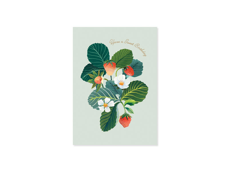 Light green paper pop up greeting card with strawberry, flower, and leaf design. 