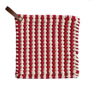 A square woven fabric pot holder with a red and off-white vertical striped pattern and a brown leather pull tab on the top left, shown against a plain white background.