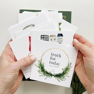 Truth for Today Christmas cards fanned out showing peeks of each card's illustration.