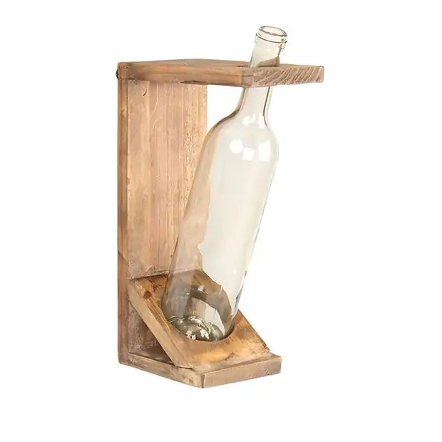 Wooden bottle drying rack with a clear glass bottle for flower stems on a white background. Wall mounted home decor. 