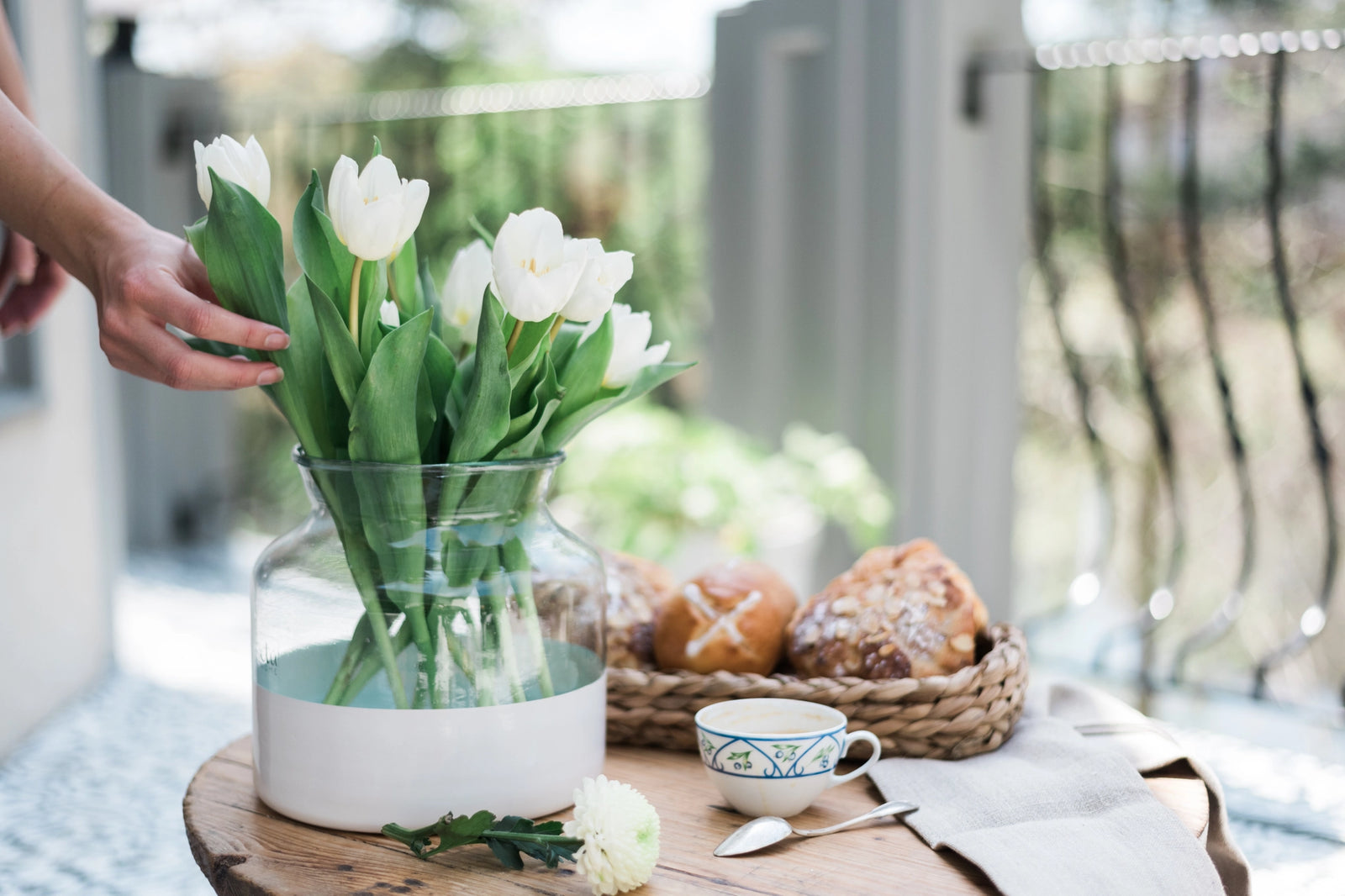 French inspired white colorblock flower vase with white tulips displayed. 
