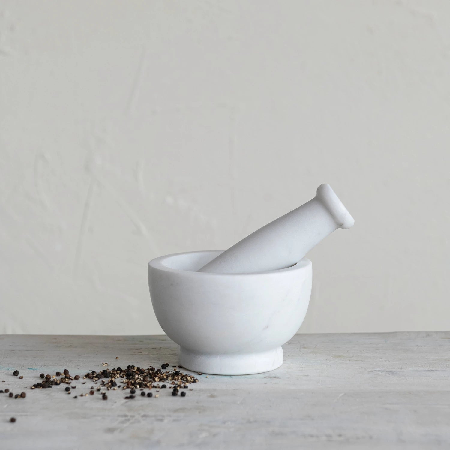 white marble mortar with pestle set