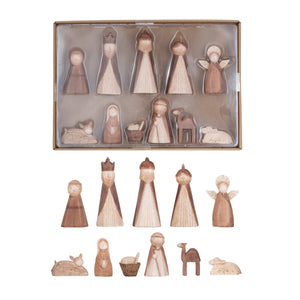 Set of wooden-like nativity scene figures displayed with packaging on a white background