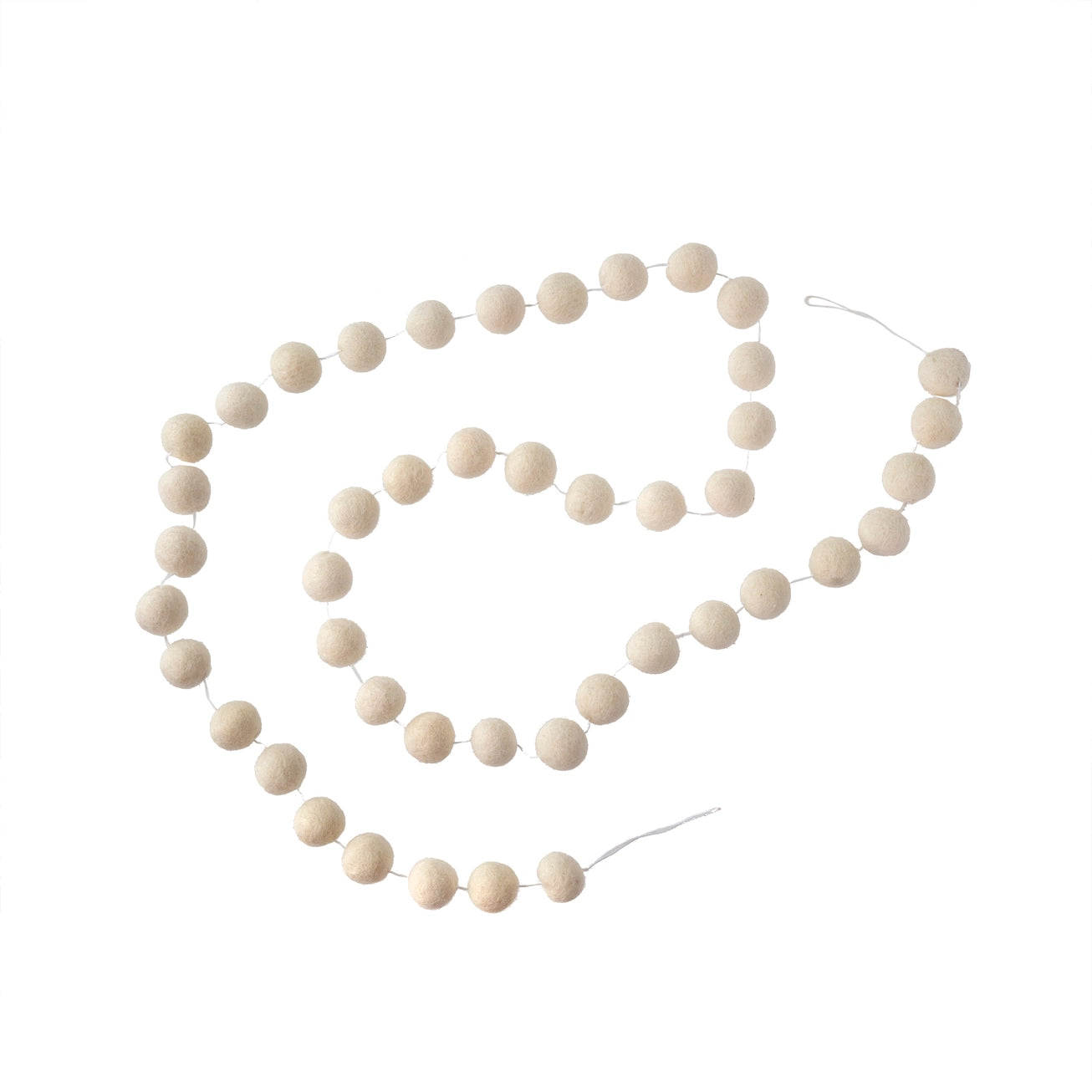 String of white wool pom-pom felt garland against a white background.
