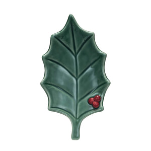 Green ceramic holly leaf with red berries on a white background