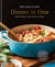 Front cover of book "Dinner in One- Exceptional and Easy One Pan Meals". Displayed is a vintage powder blue pasta pan with a Mediterranean pasta dish inside. Easy dinners. Easy family dinners. 