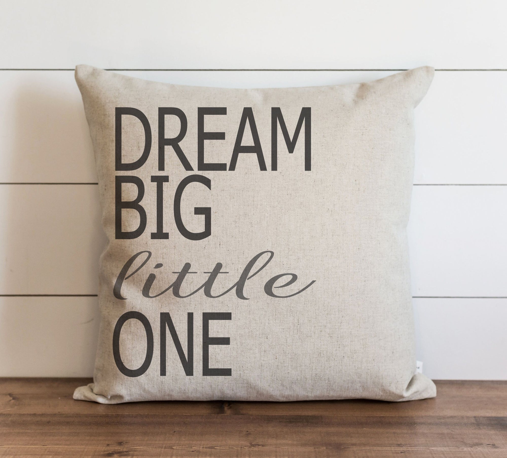 White pillow with black text 
