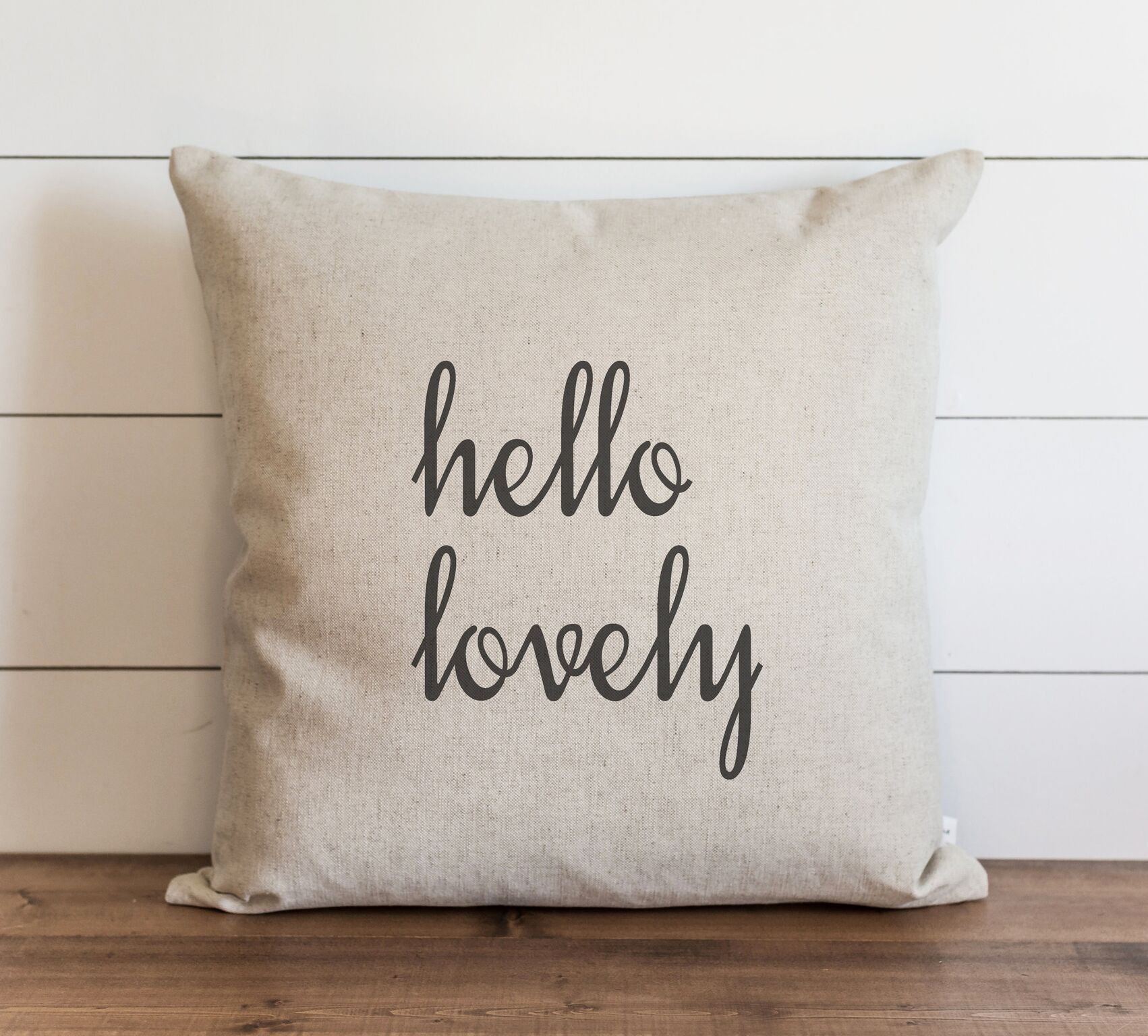 White pillow with black text hello lovely down insert